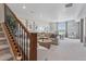 Comfortable living room with modern decor, featuring seating area, stairs and natural light at 13334 Blue Amber Ct, Parker, CO 80134