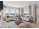 Spacious living room showcasing a fireplace, scenic views, and ample seating at 13334 Blue Amber Ct, Parker, CO 80134