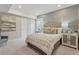 Cozy bedroom with a decorative headboard, bedside tables, and neutral color palette at 13334 Blue Amber Ct, Parker, CO 80134