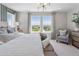 Bright primary bedroom with a king bed, bench, large windows, and views of the landscape at 13334 Blue Amber Ct, Parker, CO 80134