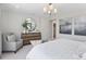Bright primary bedroom with a king bed, sitting chair, and decorative elements at 13334 Blue Amber Ct, Parker, CO 80134