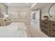 Bright main bedroom featuring a decorative headboard, dresser, and serene decor at 13334 Blue Amber Ct, Parker, CO 80134