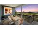 Covered patio with a dining table and seating, offering scenic views of the landscape and sky at 13334 Blue Amber Ct, Parker, CO 80134
