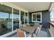 Relaxing outdoor patio with dining table, sliding glass doors, and views of the surrounding landscape at 13334 Blue Amber Ct, Parker, CO 80134
