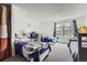 Spacious bedroom with carpet floors and ample natural light featuring three beds at 14486 E Hawaii Cir # D, Aurora, CO 80012
