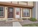 Up close view of townhome exteriors showing stone landscaping and walkways to the front door entrances at 14486 E Hawaii Cir # D, Aurora, CO 80012