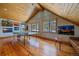 Game room with ping pong table, wood floors, and large windows at 10658 Tallberg Ln, Conifer, CO 80433