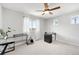Bright bedroom featuring large windows and versatile desk spaces at 18143 E 104Th Way, Commerce City, CO 80022