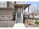 Charming front entrance with stone accents and a covered porch at 18143 E 104Th Way, Commerce City, CO 80022