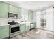 Bright kitchen with stainless steel appliances and ample cabinet space at 18143 E 104Th Way, Commerce City, CO 80022