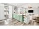 Stylish kitchen with a large kitchen island and stainless appliances at 18143 E 104Th Way, Commerce City, CO 80022