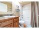 Traditional bathroom with wood vanity, neutral walls, sink, and shower with curtain at 1795 Mountain Creek Dr, Georgetown, CO 80444