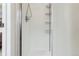 Clean white shower with a shower head and built in shelving at 1795 Mountain Creek Dr, Georgetown, CO 80444