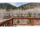 A wood deck provides a serene place to enjoy the surrounding nature views and peaceful atmosphere at 1795 Mountain Creek Dr, Georgetown, CO 80444