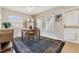 Bright dining area with wooden table, chairs, ample windows, and convenient side door access at 1795 Mountain Creek Dr, Georgetown, CO 80444