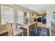 Dining space adjacent to the kitchen with natural light, wooden furniture, and stylish area rug at 1795 Mountain Creek Dr, Georgetown, CO 80444