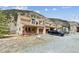 Well-maintained townhouse complex featuring covered porches, garages, and mountain views at 1795 Mountain Creek Dr, Georgetown, CO 80444