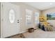 Bright foyer features a decorative door, neutral walls, and comfortable seating area at 1795 Mountain Creek Dr, Georgetown, CO 80444