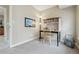 Cozy home office features a desk with built-in shelves, carpeting, and neutral paint at 1795 Mountain Creek Dr, Georgetown, CO 80444
