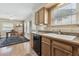Bright, open kitchen connects to dining area, features wood cabinets and durable laminate countertops at 1795 Mountain Creek Dr, Georgetown, CO 80444