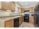 Classic kitchen featuring oak cabinets, laminate countertops, and black appliances on hardwood floor at 1795 Mountain Creek Dr, Georgetown, CO 80444