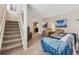 Inviting living room with staircase, comfortable furniture, and tasteful decor at 1795 Mountain Creek Dr, Georgetown, CO 80444