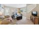 Cozy living room featuring comfortable seating, neutral walls, and ample natural light from the windows at 1795 Mountain Creek Dr, Georgetown, CO 80444