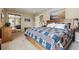Spacious main bedroom featuring neutral carpeting, mountain art, and high ceilings at 1795 Mountain Creek Dr, Georgetown, CO 80444