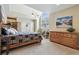 Bright main bedroom with high ceilings, mountain view artwork, and a comfortable quilted bed at 1795 Mountain Creek Dr, Georgetown, CO 80444