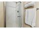 Shower with glass doors, white tile, chrome fixtures and towel bar at 1795 Mountain Creek Dr, Georgetown, CO 80444