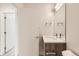 Bright bathroom featuring a modern single vanity, white countertops, and sleek fixtures at 1810 Irving St # 4, Denver, CO 80204