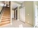 Inviting entryway with a staircase and white tile flooring, leading to various rooms at 1810 Irving St # 4, Denver, CO 80204