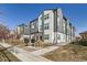 Attractive townhouses with modern gray and white siding and well-maintained landscaping at 1810 Irving St # 4, Denver, CO 80204
