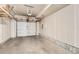 Spacious unfinished garage with exposed ceiling and concrete floor at 1810 Irving St # 4, Denver, CO 80204