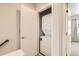 Convenient laundry closet with a stacked washer and dryer, maximizing space efficiency at 1810 Irving St # 4, Denver, CO 80204