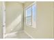 Versatile room with natural light streaming through a patterned glass window at 1810 Irving St # 4, Denver, CO 80204