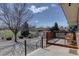 Relax on the back deck overlooking the spacious yard and park at 7890 W 43Rd Pl, Wheat Ridge, CO 80033