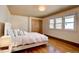 Bright bedroom with hardwood floors, a closet, and natural light from two windows at 7890 W 43Rd Pl, Wheat Ridge, CO 80033