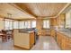 Eat-in kitchen features custom wood cabinets, granite countertops, and stainless appliances at 7890 W 43Rd Pl, Wheat Ridge, CO 80033