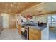Kitchen features modern gas range, granite countertops, and custom wood cabinets at 7890 W 43Rd Pl, Wheat Ridge, CO 80033