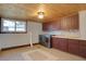 Spacious laundry room with modern appliances, storage cabinets, and ample counter space at 7890 W 43Rd Pl, Wheat Ridge, CO 80033