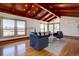 Bright and airy living room featuring vaulted ceilings, hardwood floors and large windows at 7890 W 43Rd Pl, Wheat Ridge, CO 80033
