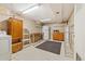 View of a multi-purpose basement space including laundry, storage and work areas at 8137 Vanguard Dr, Denver, CO 80221