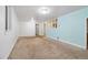 Finished basement with a carpeted floor and bright walls at 8137 Vanguard Dr, Denver, CO 80221