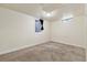 An additional basement bedroom showing a neutral wall color and small window at 8137 Vanguard Dr, Denver, CO 80221