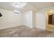 A carpeted room with neutral walls and a double door closet in a finished basement at 8137 Vanguard Dr, Denver, CO 80221