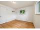 Clean, bright bedroom with hardwood floors, natural light, and closet at 8137 Vanguard Dr, Denver, CO 80221