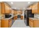 Updated kitchen featuring stainless steel appliances, granite countertops, and tile backsplash at 8137 Vanguard Dr, Denver, CO 80221