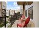 Inviting balcony with seating provides a peaceful outdoor retreat with community views at 524 E Hinsdale Ave, Littleton, CO 80122