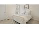 Serene bedroom with a soft bed, neutral tones, and a bright window at 524 E Hinsdale Ave, Littleton, CO 80122